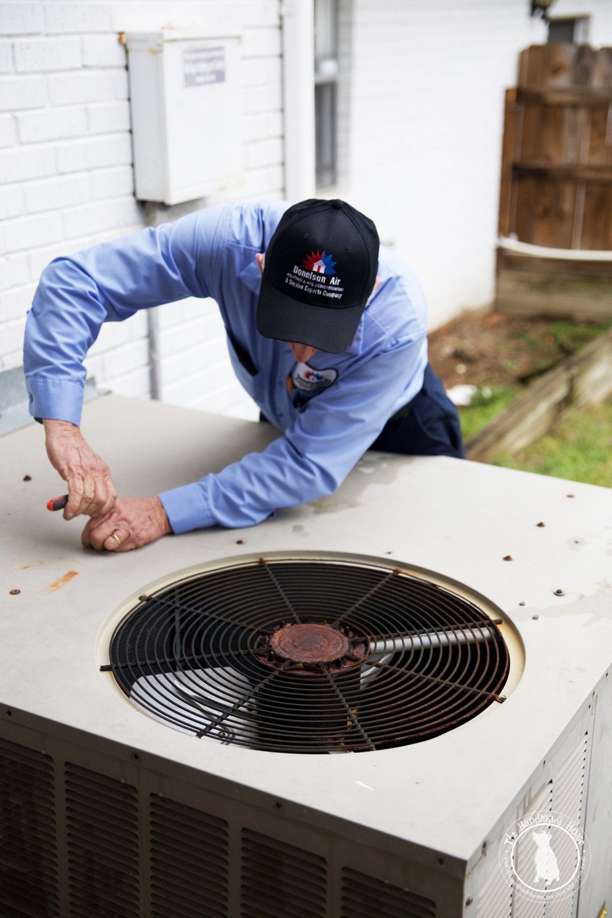 inspecting_an_old_unit_HVAC